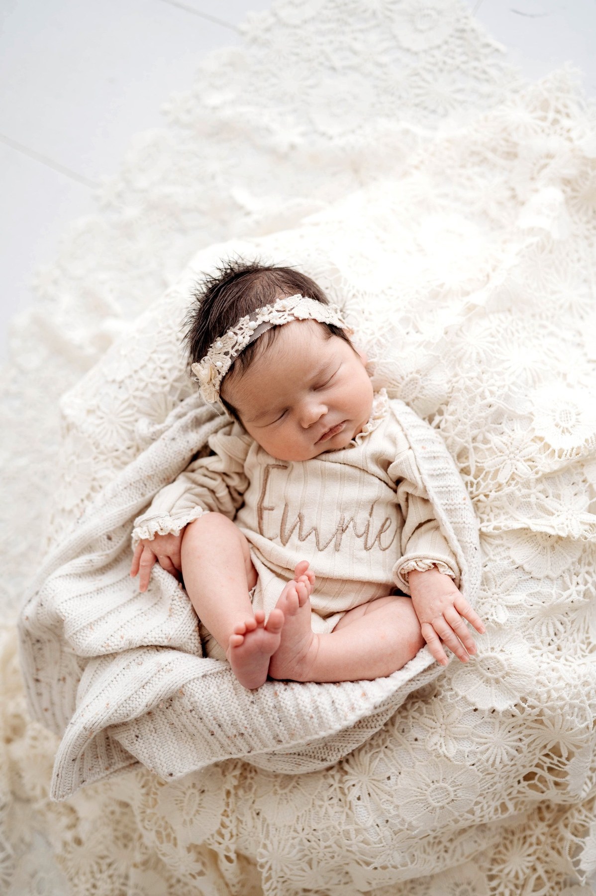 Newborn wearing a handmade personalised romper by Sweet Sews by Ann