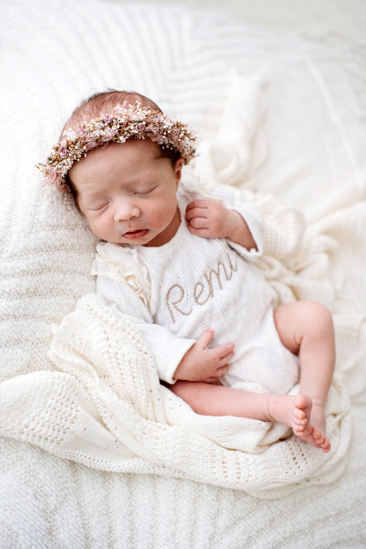 Newborn wearing a handmade personalised romper by Sweet Sews by Ann