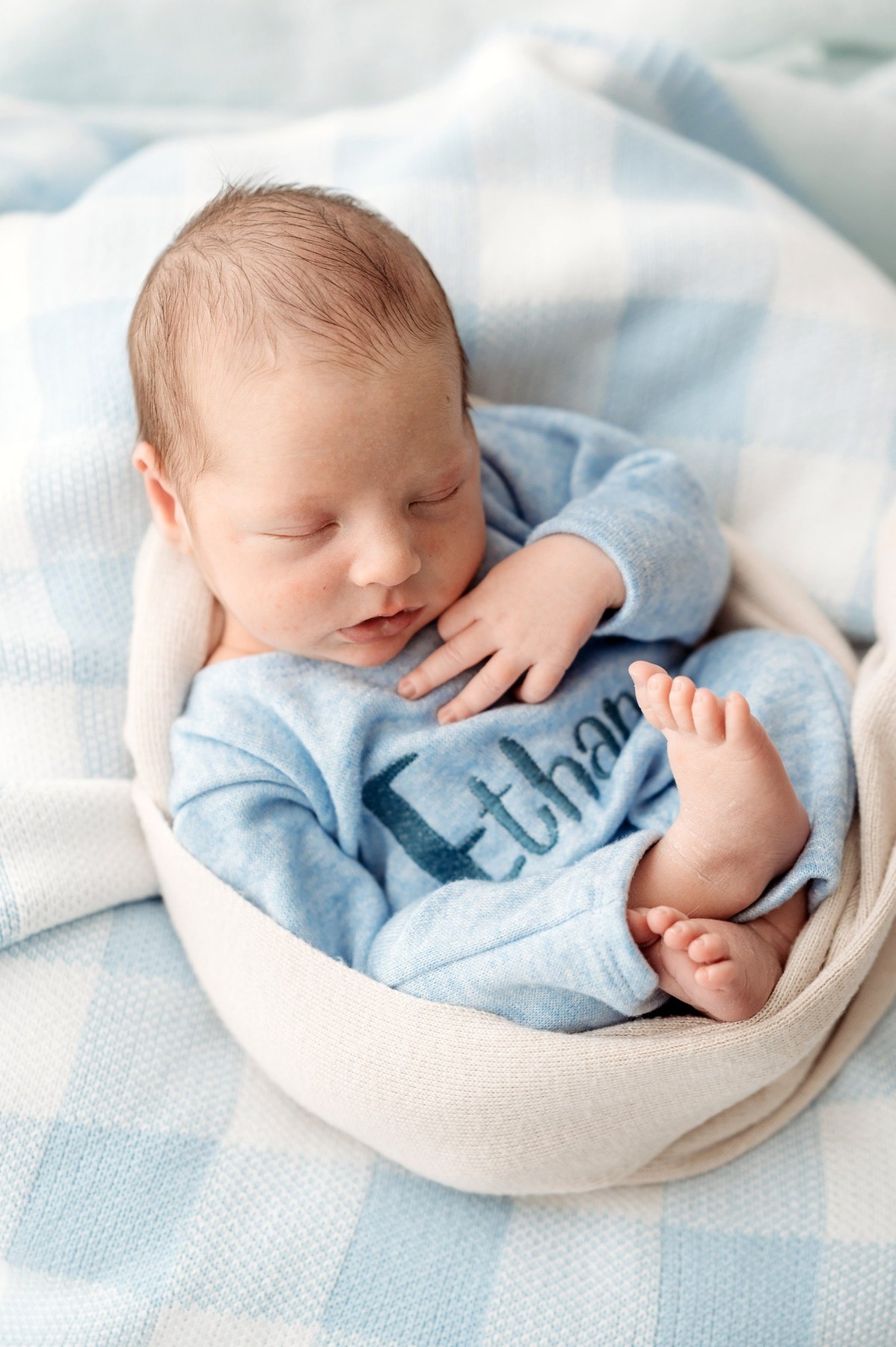 Newborn wearing a handmade personalised romper by Sweet Sews by Ann