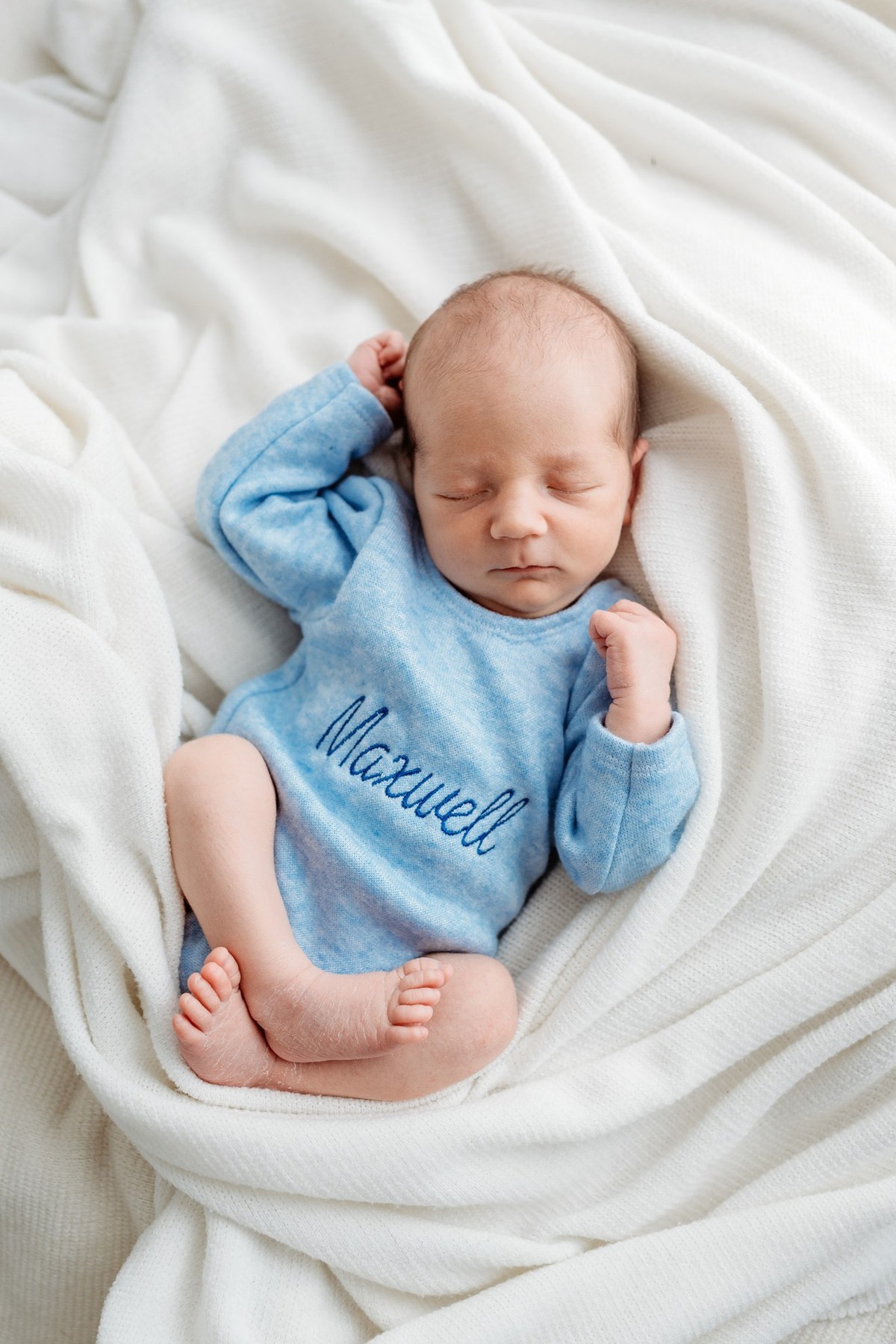 Newborn wearing a handmade personalised romper by Sweet Sews by Ann