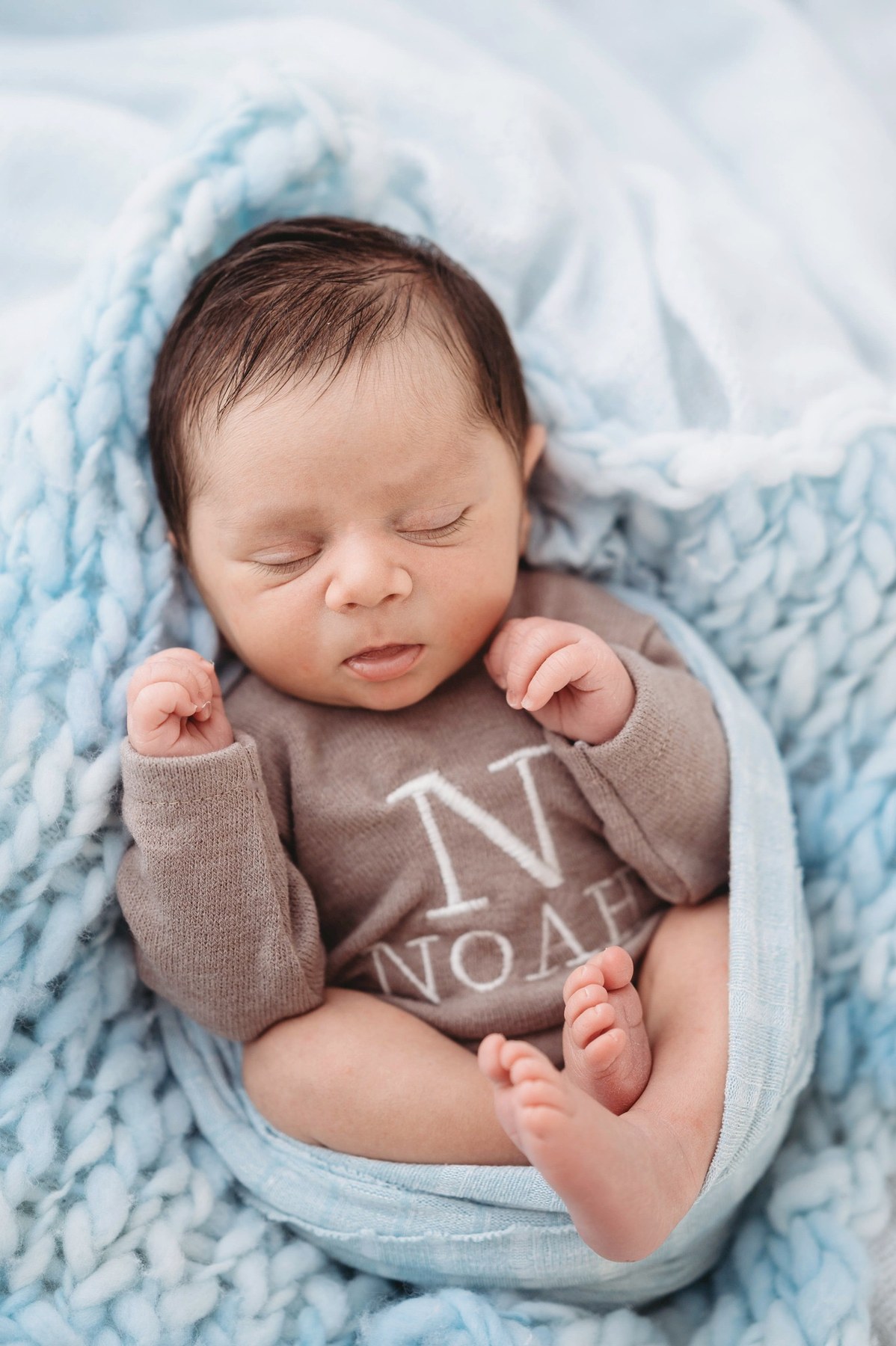 Newborn wearing a handmade personalised romper by Sweet Sews by Ann
