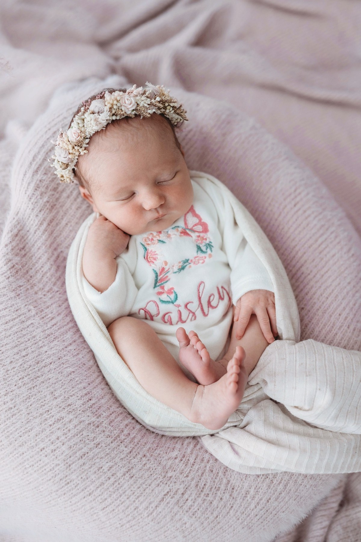 Newborn wearing a handmade personalised romper by Sweet Sews by Ann