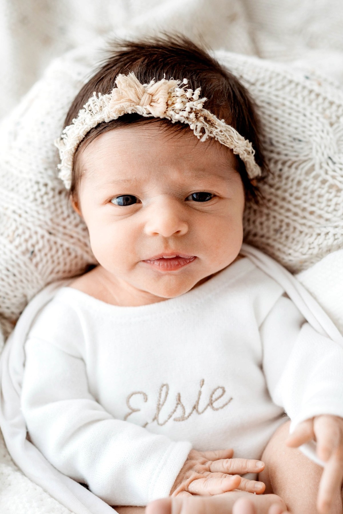 Newborn wearing a handmade personalised romper by Sweet Sews by Ann