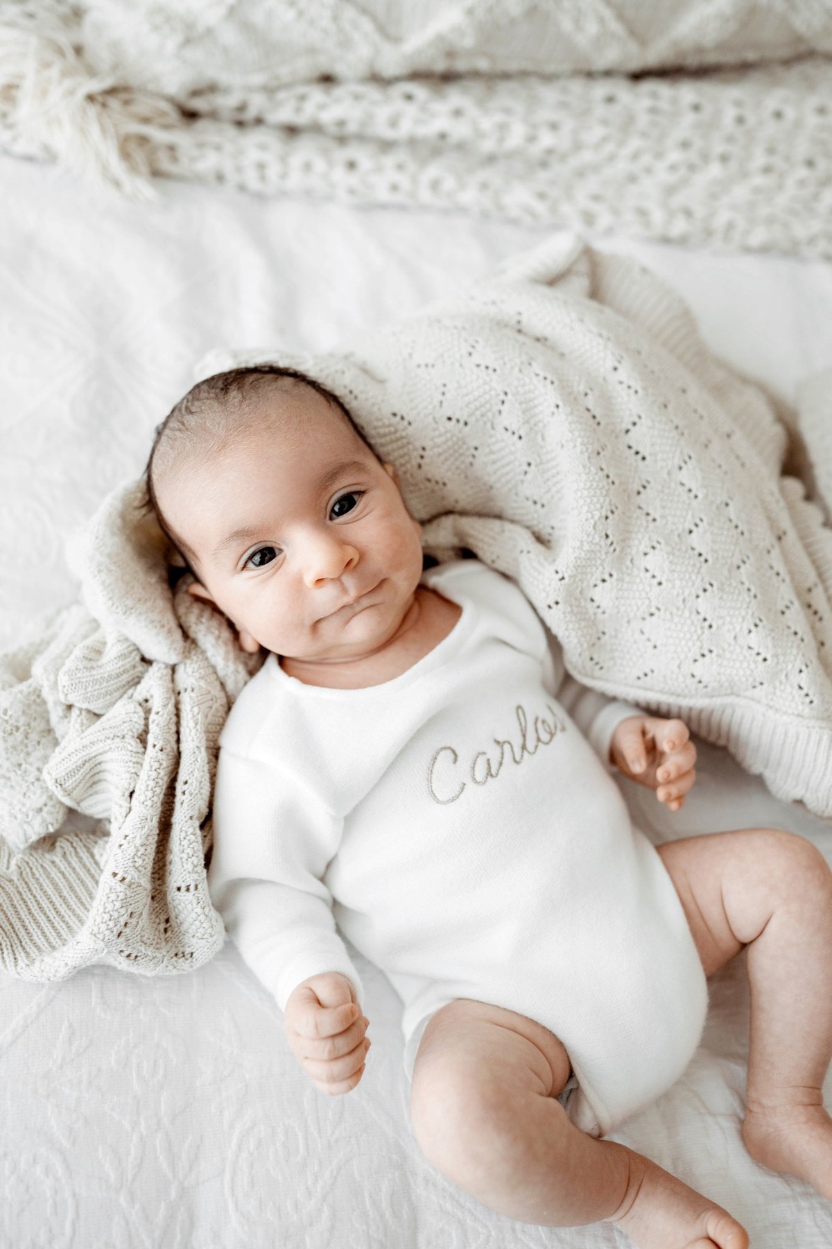 Newborn wearing a handmade personalised romper by Sweet Sews by Ann