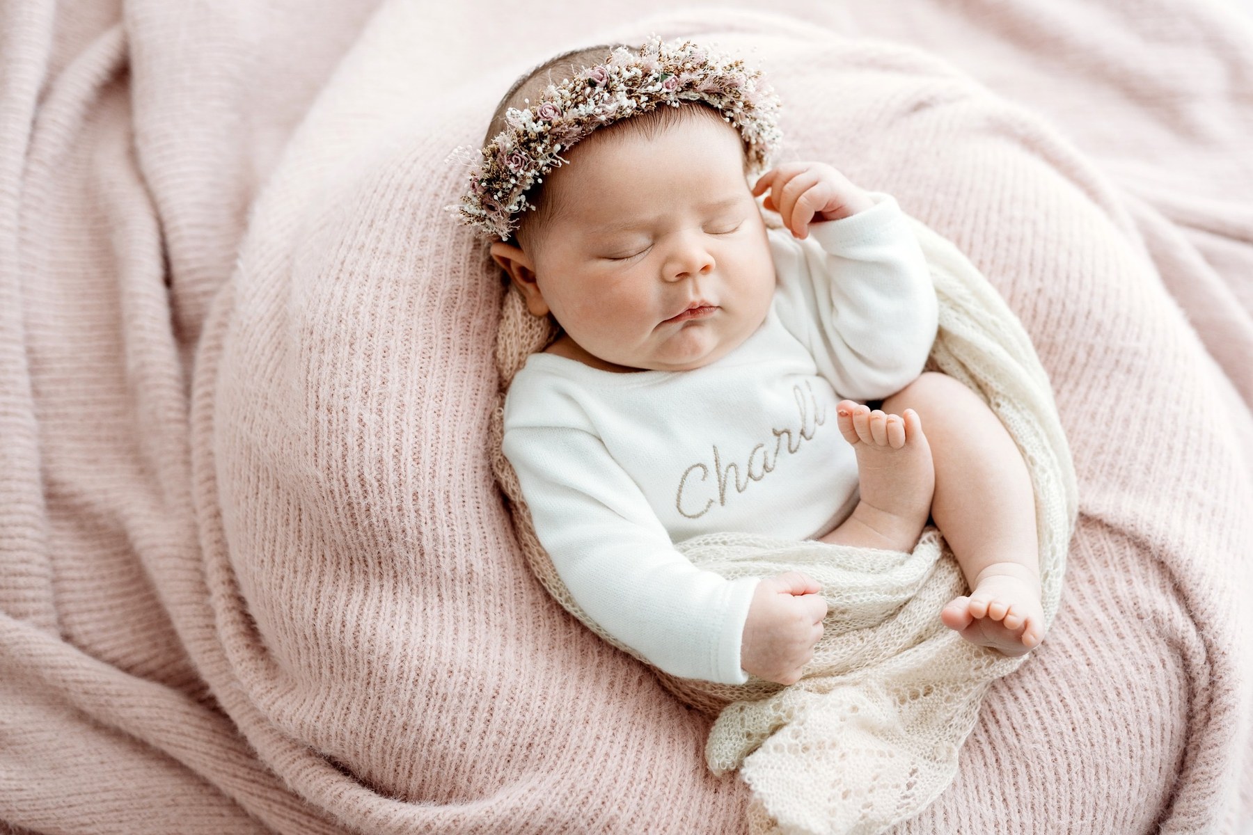 Newborn wearing a handmade personalised romper by Sweet Sews by Ann